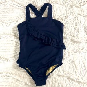 Navy toddler ruffled bathing suit.